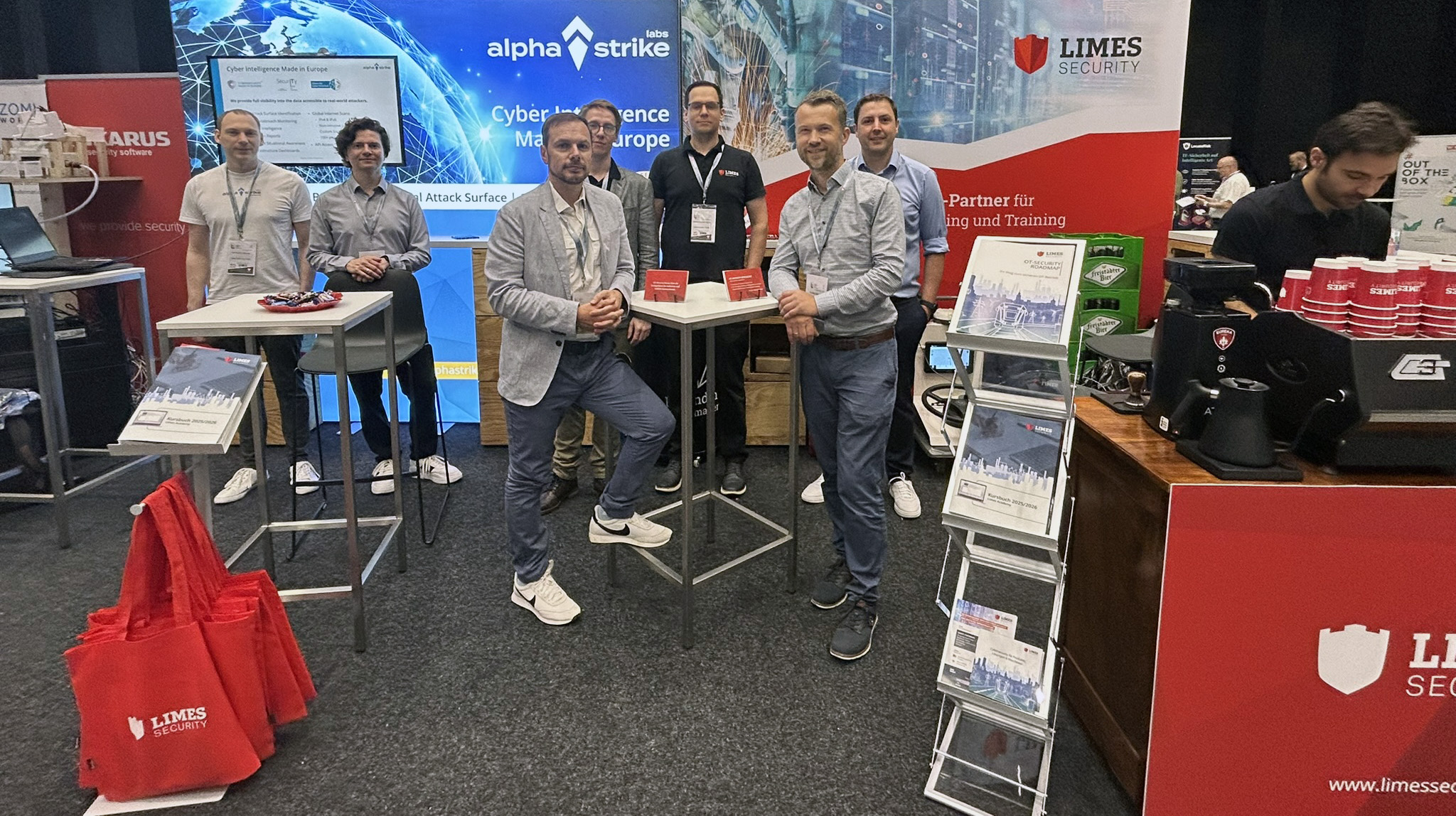 Employees of Limes Security and ASL at the booth of the IKT Security Conference 2025